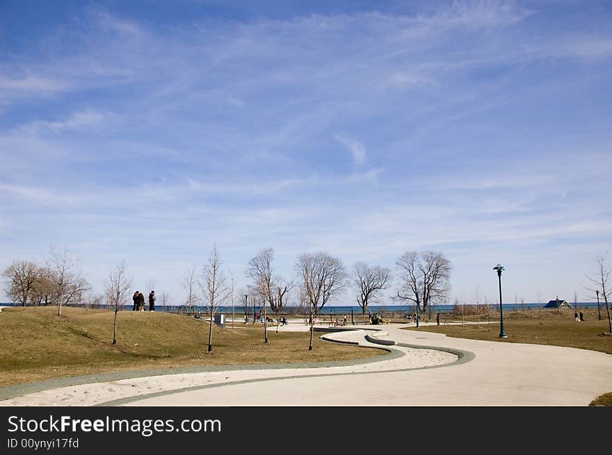 Landscape in spring with a lake in the background and yelowish grass