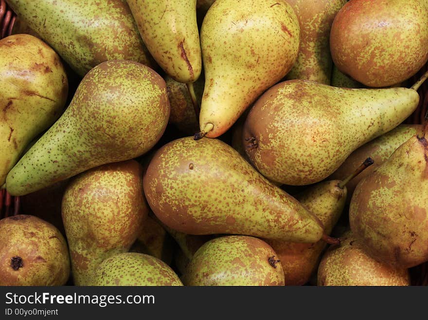 A pile of pears at a farmers market. A pile of pears at a farmers market