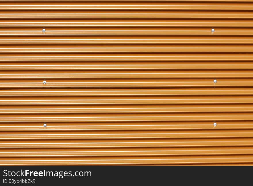 Orange corrugated metal, perfect for designs or backgrounds. Orange corrugated metal, perfect for designs or backgrounds