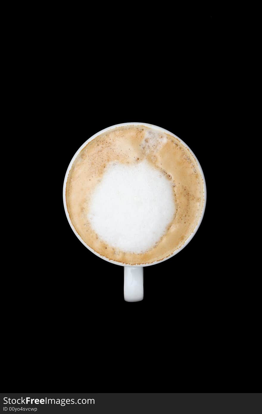 A top view shot of a  cup of coffee isolated on black. A top view shot of a  cup of coffee isolated on black