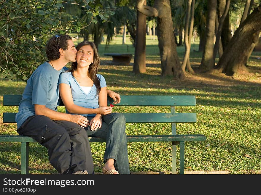 Happy Couple On A Bench - Horizontal