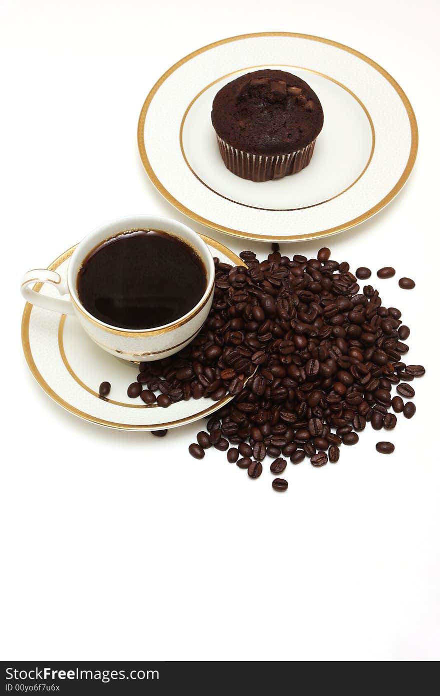 A top view shot of a a cup of coffee with muffins. A top view shot of a a cup of coffee with muffins