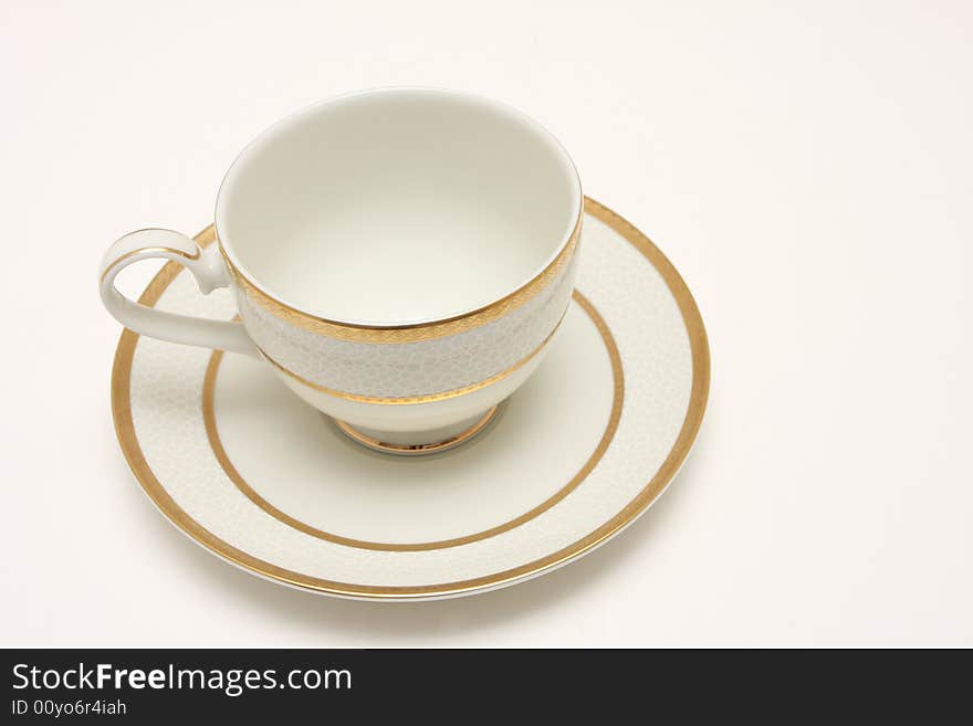 A top view shot of an empty cup of coffee isolated on white