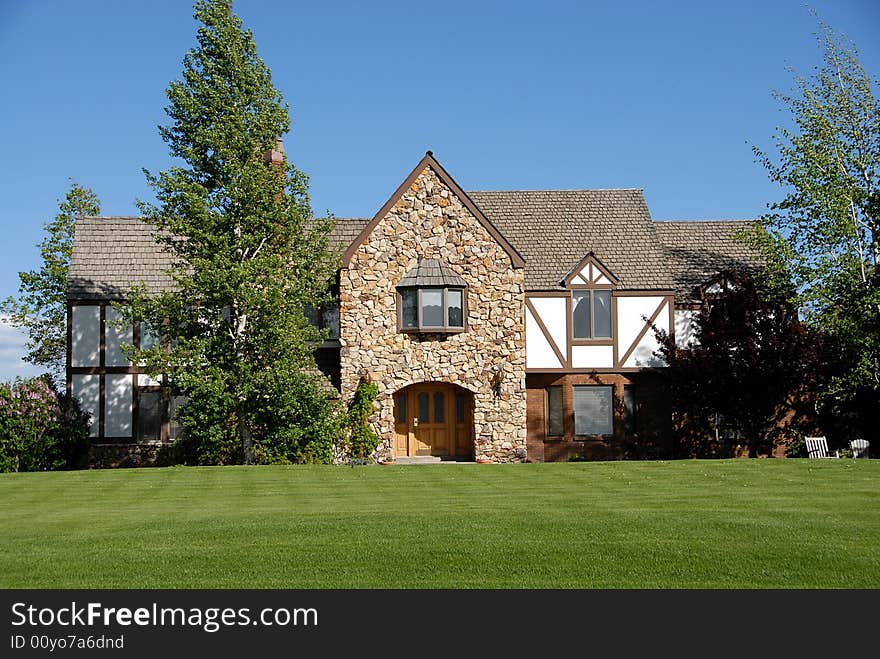 350,000 family home made of brick, with a blue sky and landscape yard. 350,000 family home made of brick, with a blue sky and landscape yard