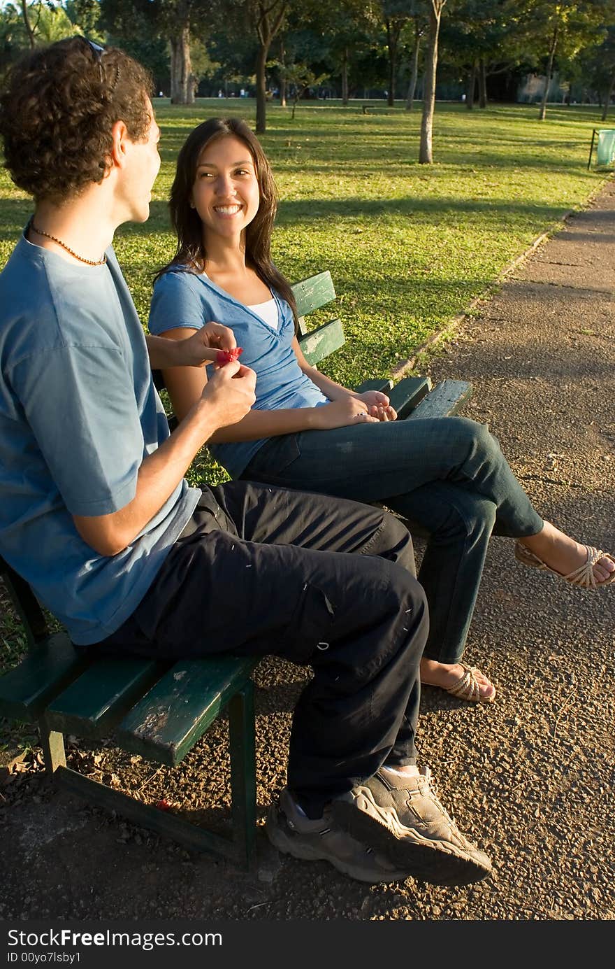 Young Couple on a Park Bench - Vertical