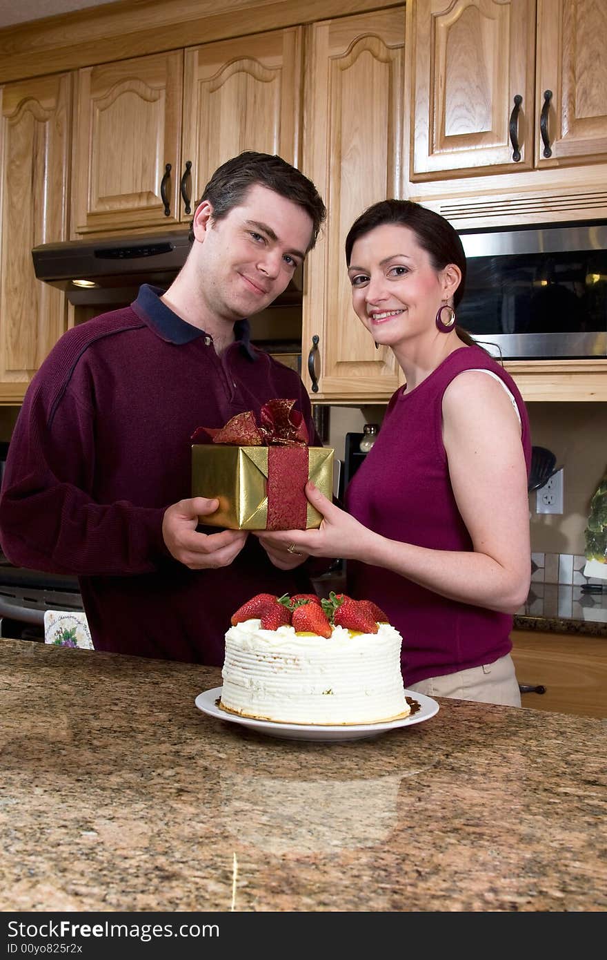 Happy Couple in the Kitchen - Vertical