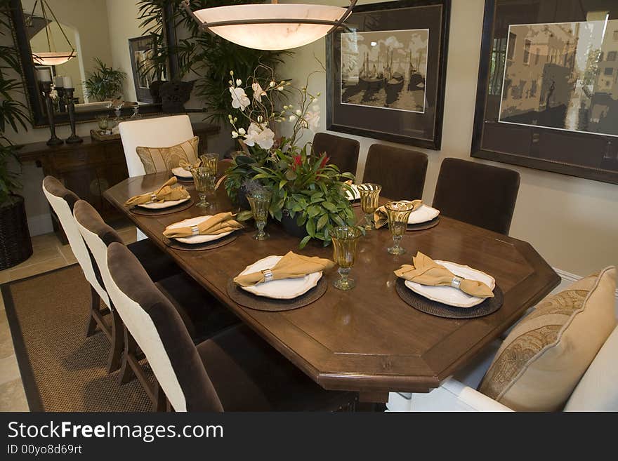 Luxury home dining table with exquisite tableware. Luxury home dining table with exquisite tableware.