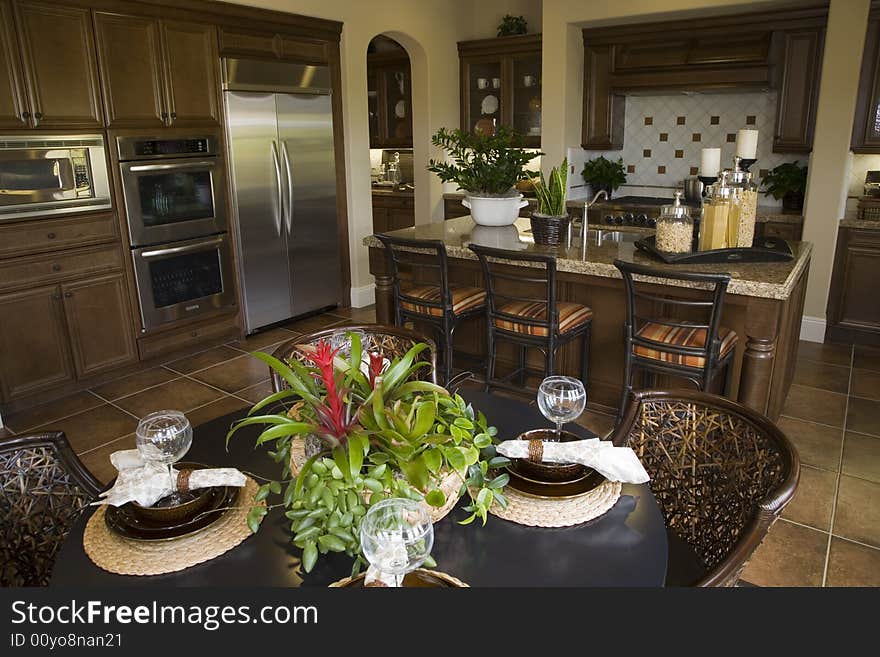 Decorated table with kitchen in the background. Decorated table with kitchen in the background.