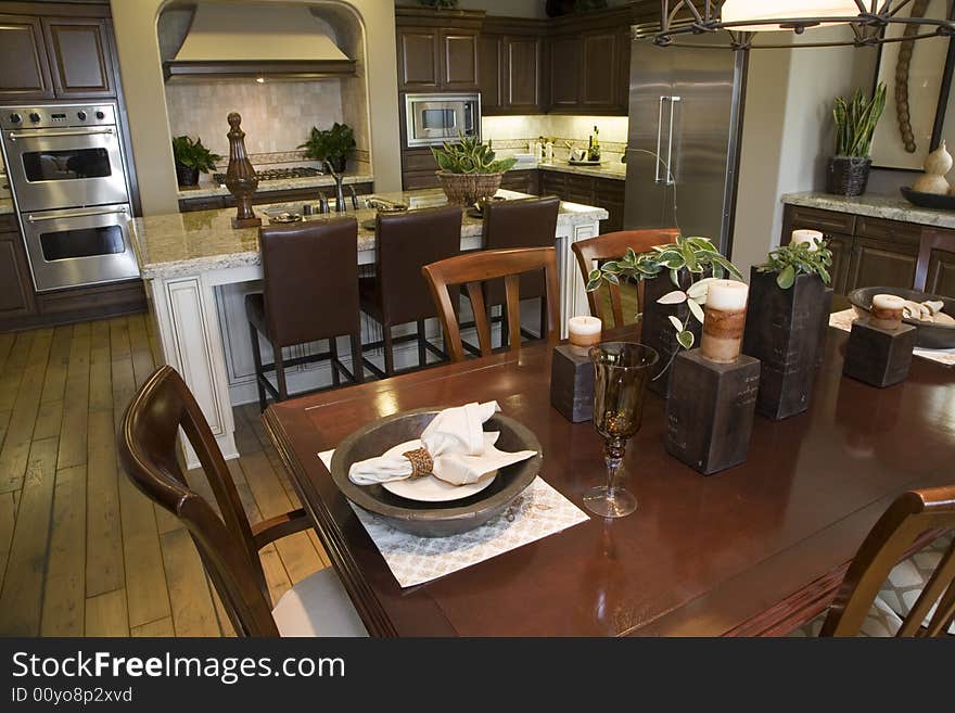 Decorated table with kitchen in the background. Decorated table with kitchen in the background.