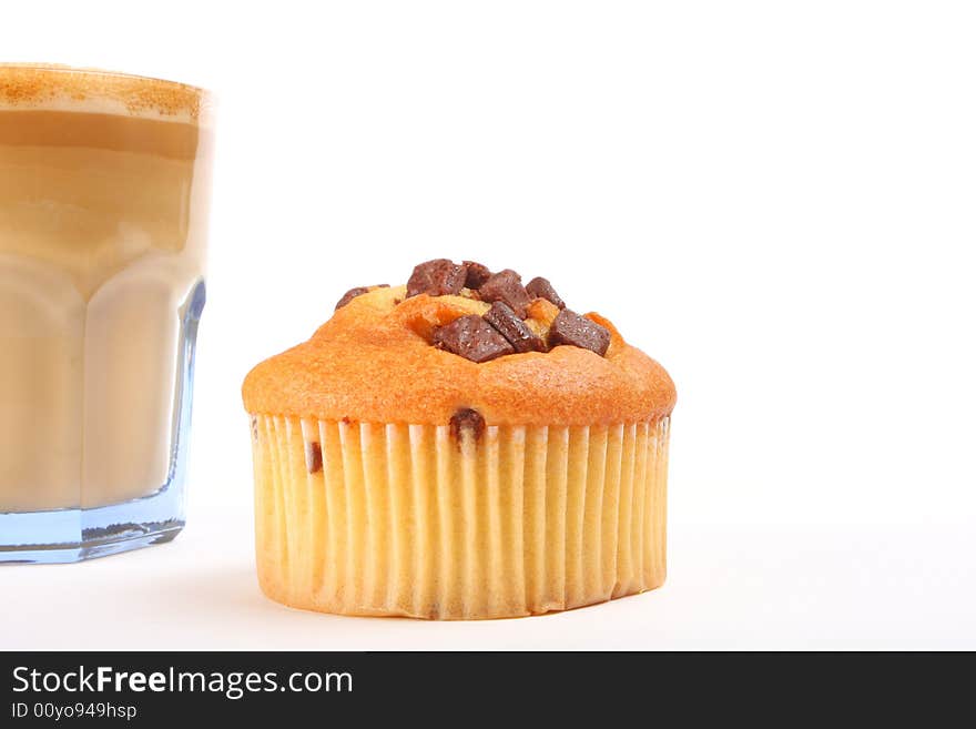 A  cup of coffee with muffin isolated on white. A  cup of coffee with muffin isolated on white