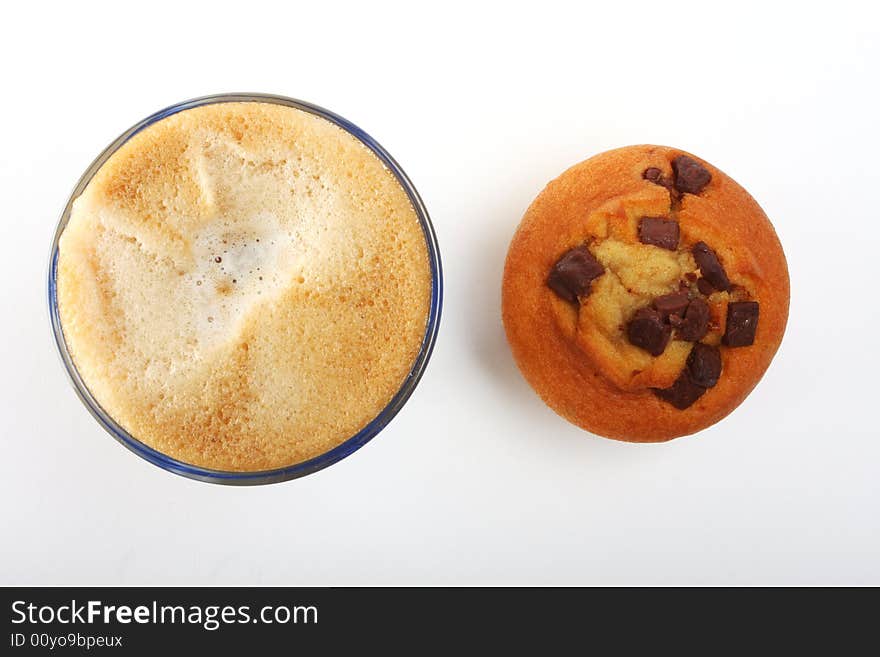 A top view shot of a a cup of coffee with muffins. A top view shot of a a cup of coffee with muffins