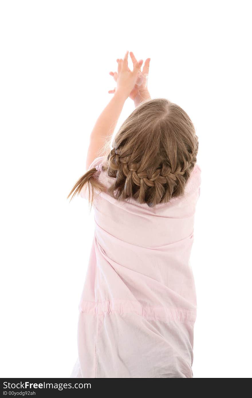 Little girl catching soap sud - view from a back. Studio shot on white. Little girl catching soap sud - view from a back. Studio shot on white.