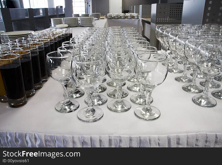 Empty wine glasses and full glasses of fruit juice. Empty wine glasses and full glasses of fruit juice