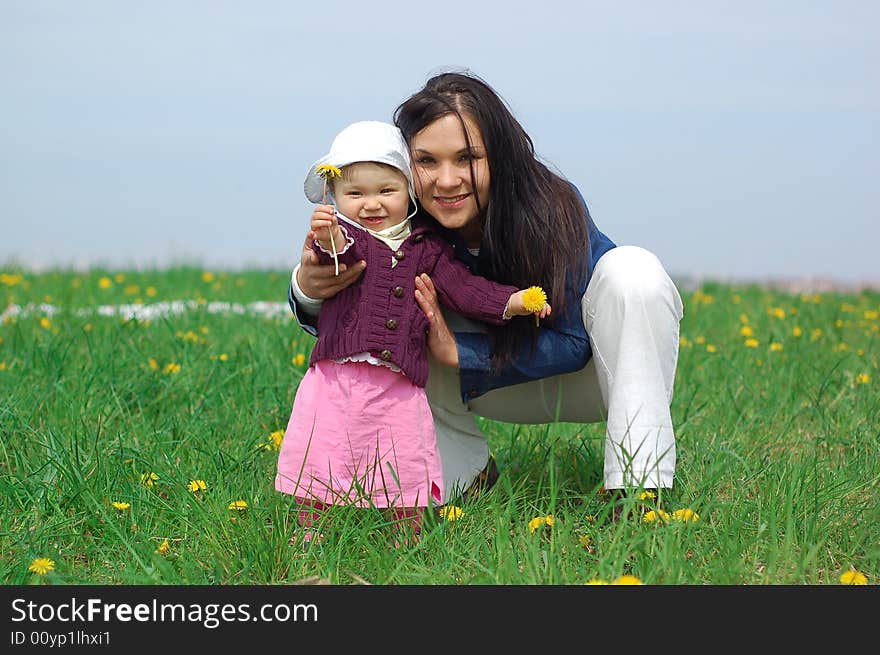 Happy family on green meadow. Happy family on green meadow