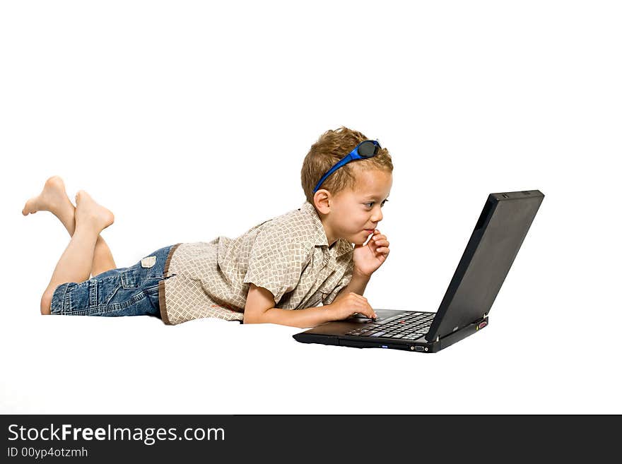 Young boy with laptop - isolated on white