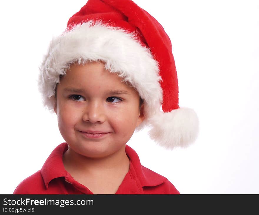 Cute ethnic boy with a santa hat. Cute ethnic boy with a santa hat