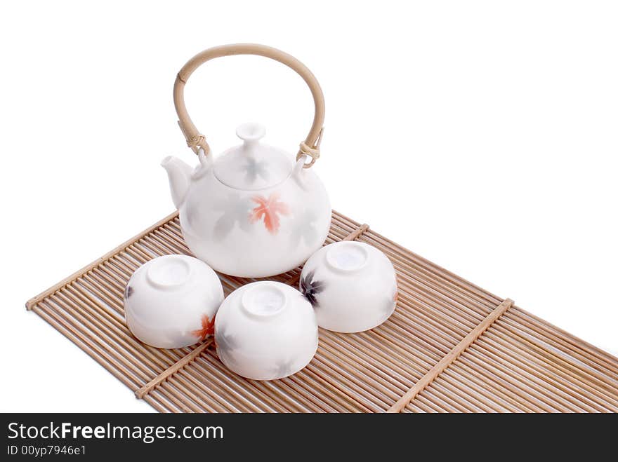 White chinese tea set on white background.