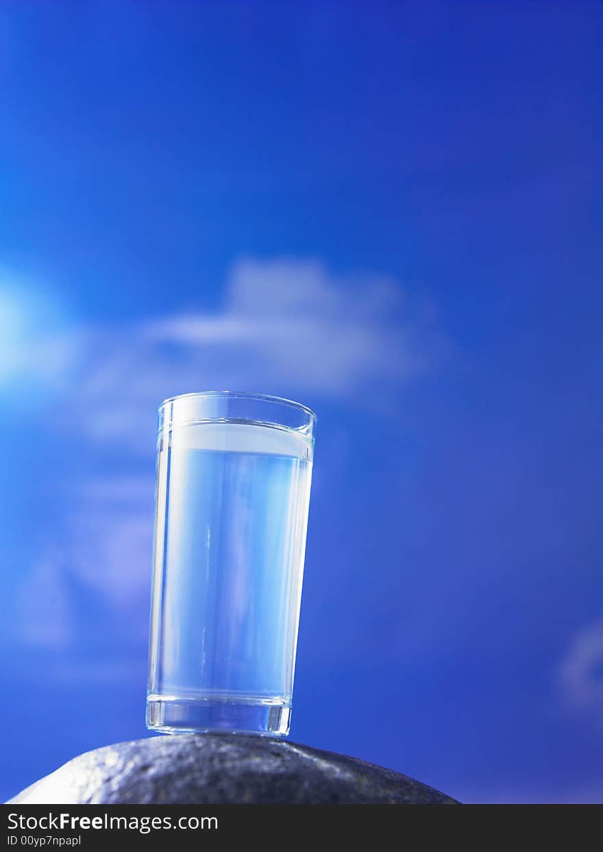 A glass of water with blue sky