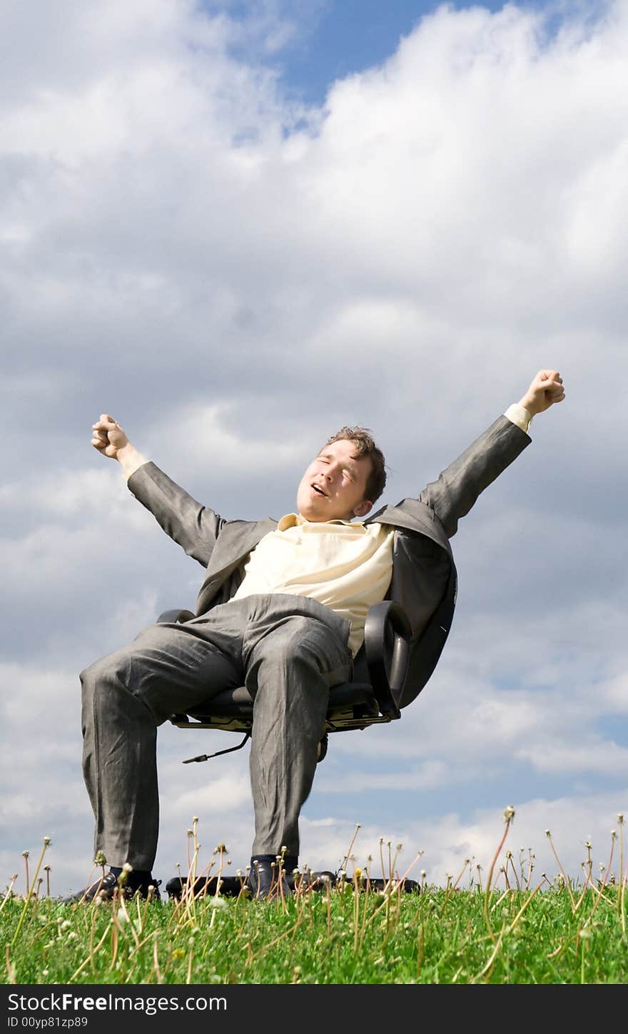 The young businessman sitting on a chair. The young businessman sitting on a chair