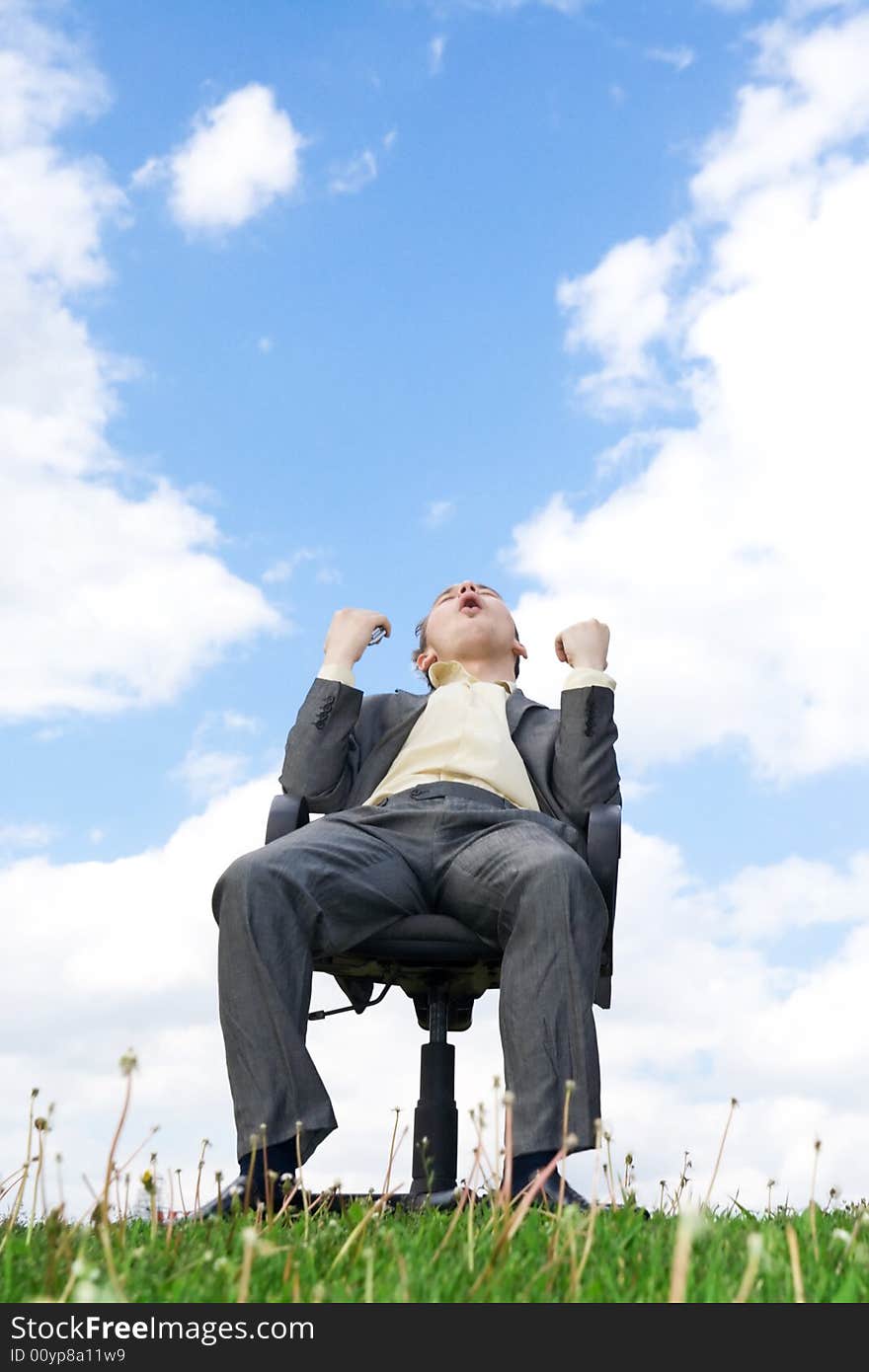 The Businessman Sitting On A Chair