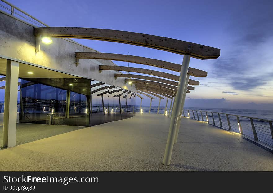 Modern building at the end of a brand new pier photograhed at dusk in tuscany, Italy. Modern building at the end of a brand new pier photograhed at dusk in tuscany, Italy