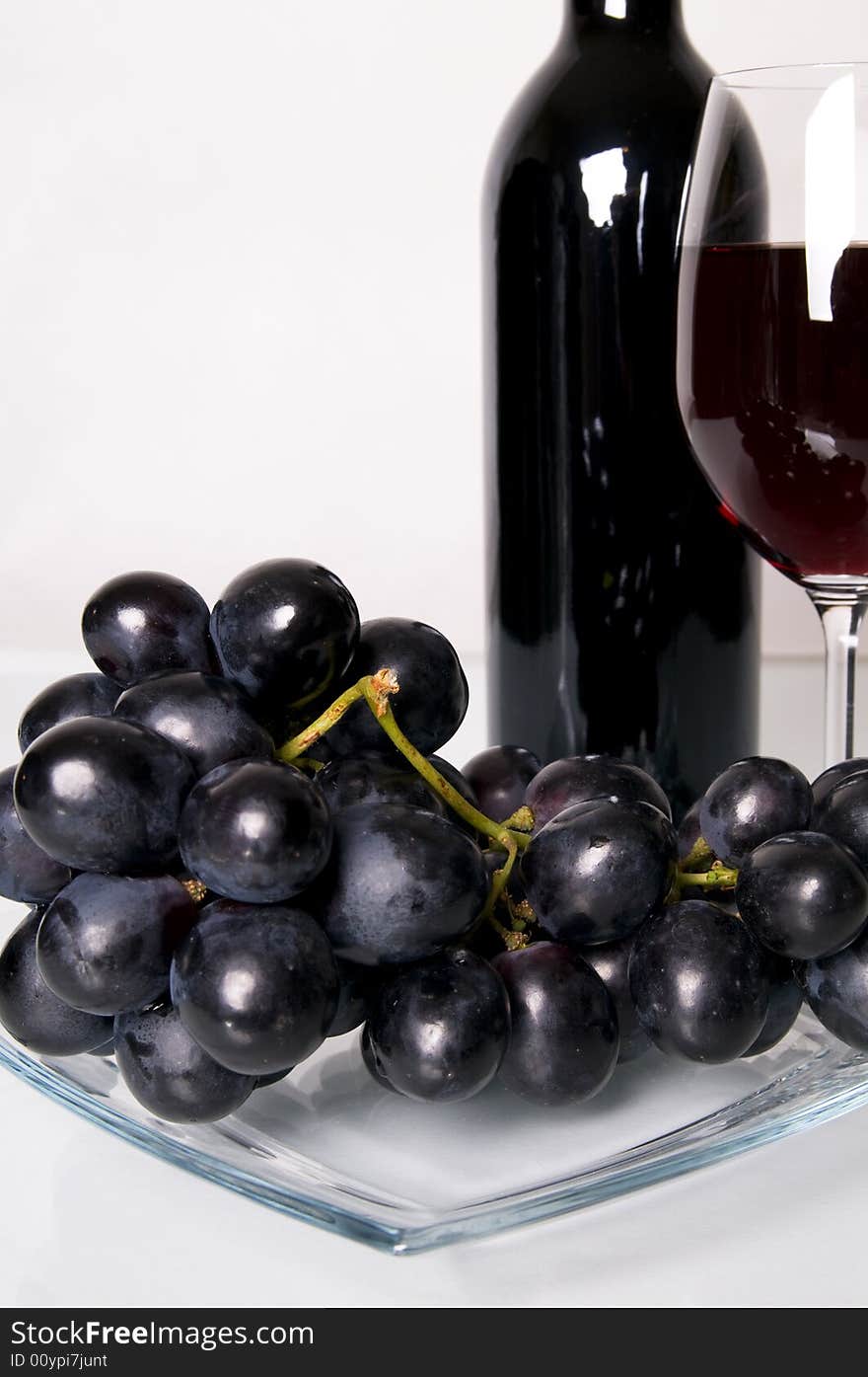 Glass of red wine and grapes. Glass of red wine and grapes.