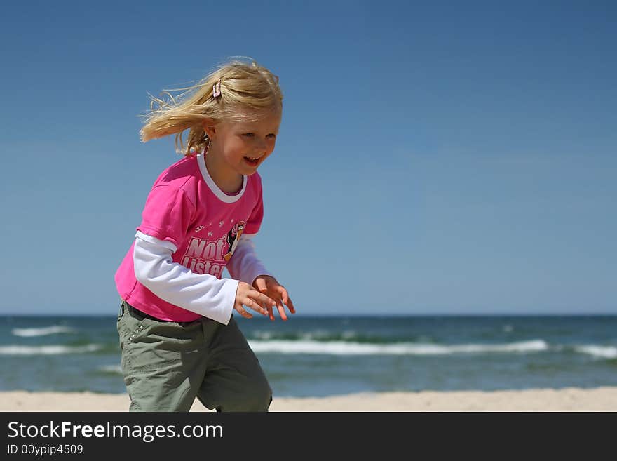 Happy Girl On The Beach