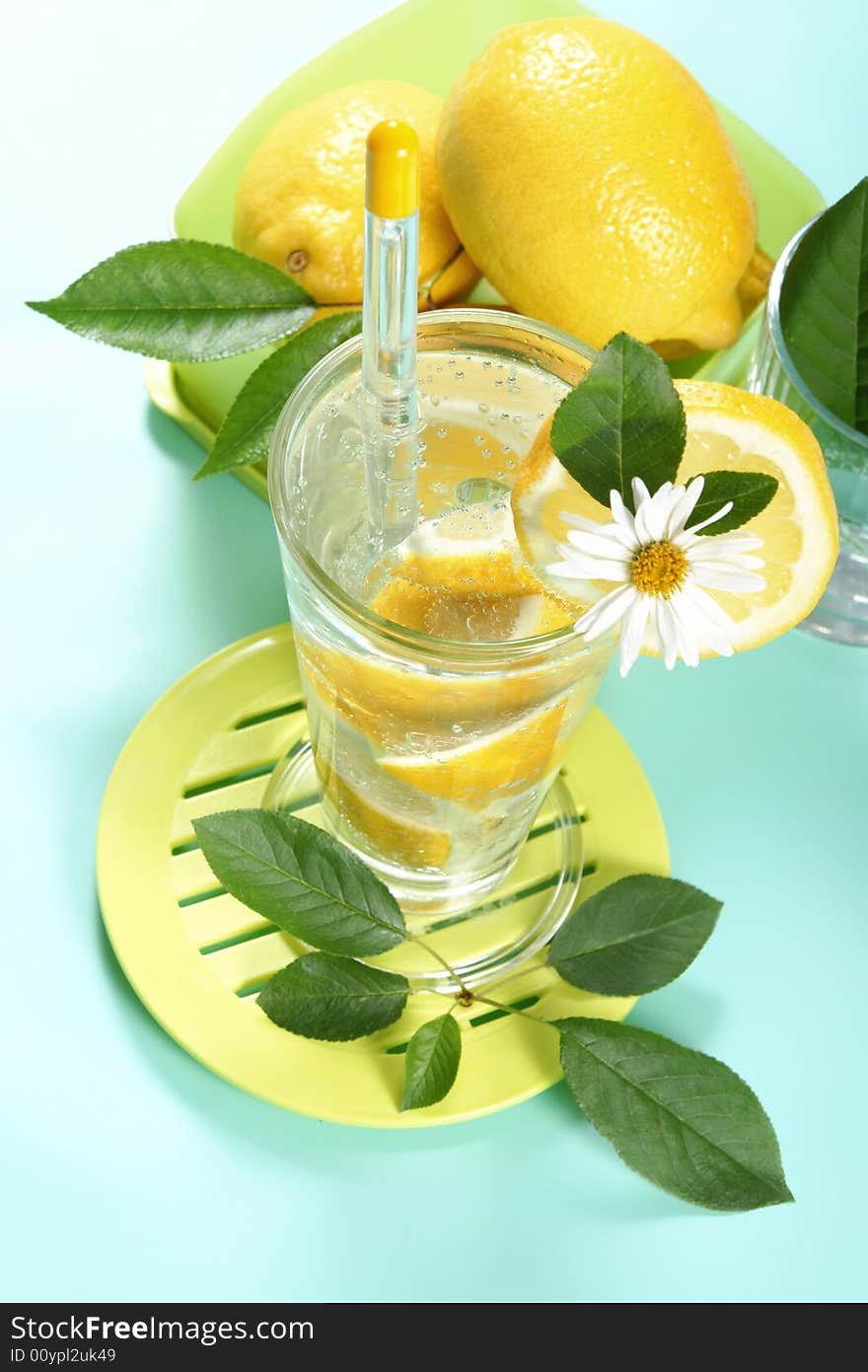 Closeup of glass of iced cold soda with lemon. Closeup of glass of iced cold soda with lemon