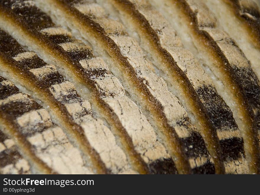 Appetizing fresh bread's slices with brown crust