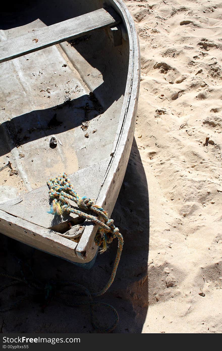 Old row boat on a beach.