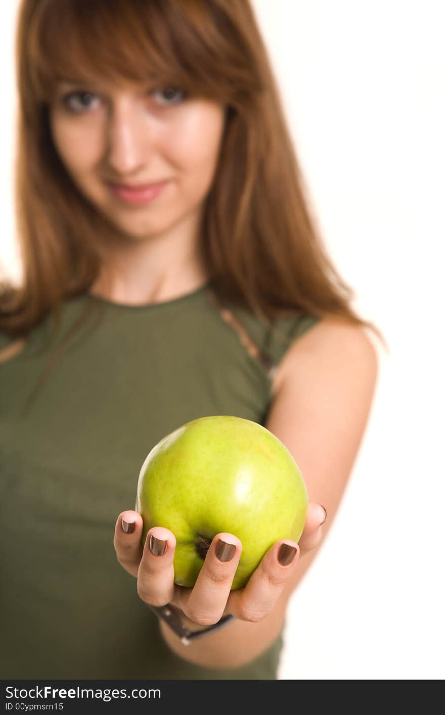 Fitness girl with green apple, focus on fruit, isolated on white background