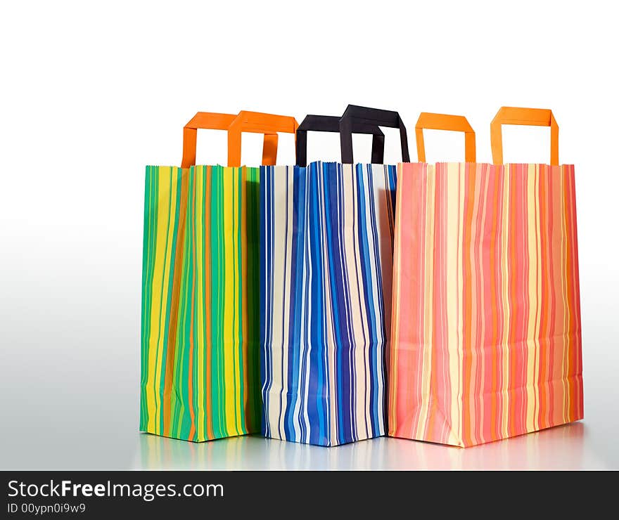 Three shopping bags on white background