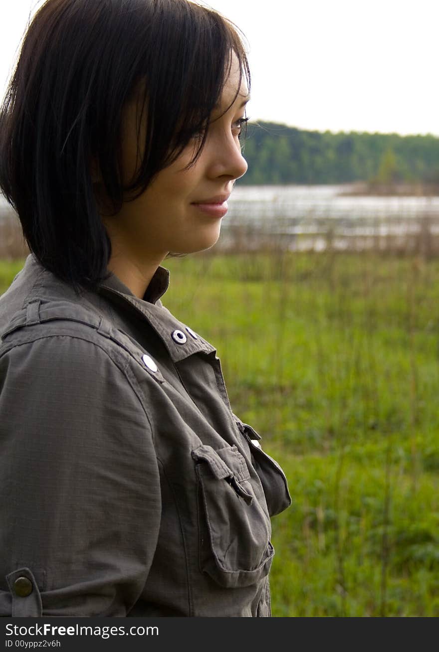 Pretty brunette near lake