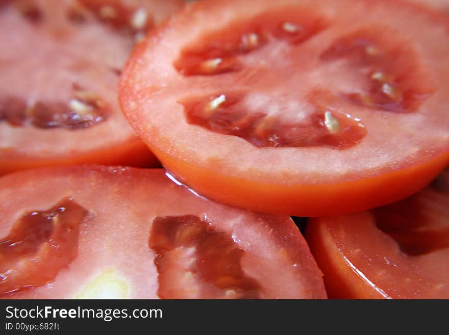 A close up view of slices of roma tomatoes