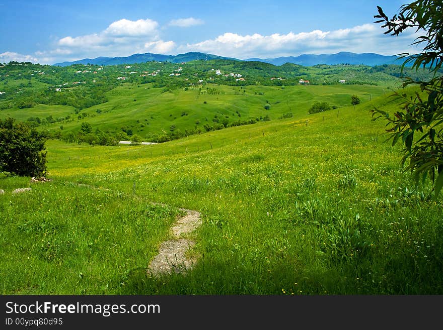 Green fresh hills and blue cloudy sky. Green fresh hills and blue cloudy sky