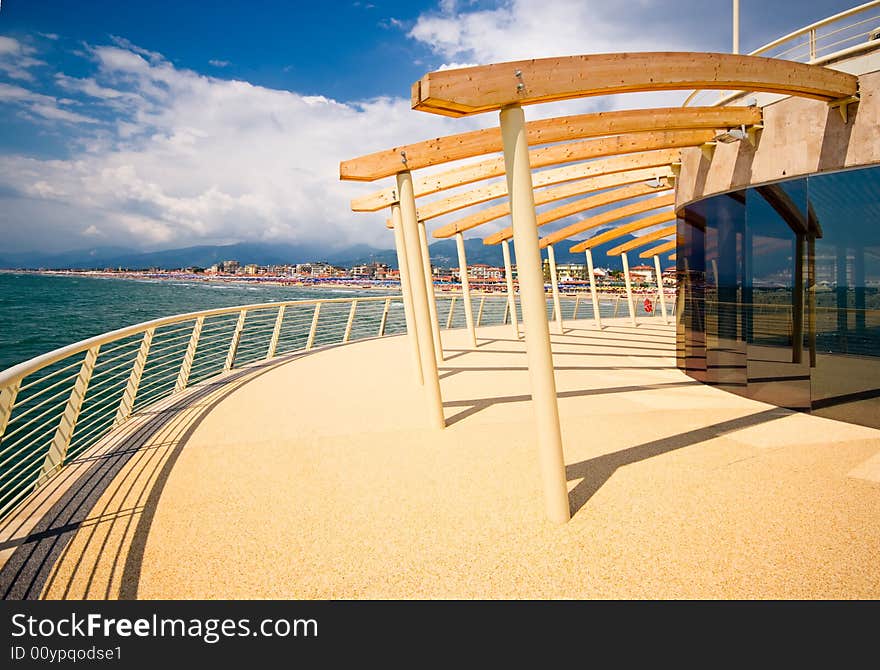 Modern building at the end of a brand new pier photograhed at dusk in tuscany, Italy. Modern building at the end of a brand new pier photograhed at dusk in tuscany, Italy