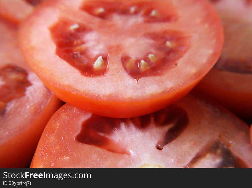 A close up view of slices of roma tomatoes