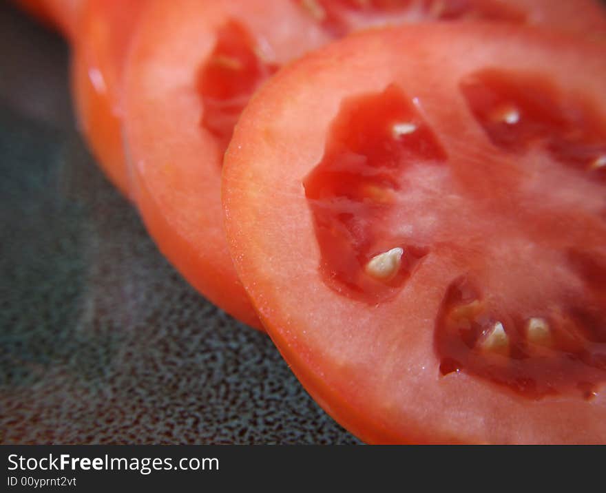 A close up view of slices of roma tomatoes