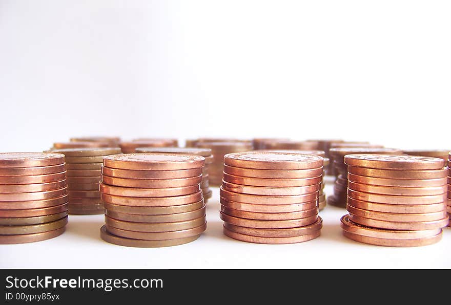 Piled coins on white background