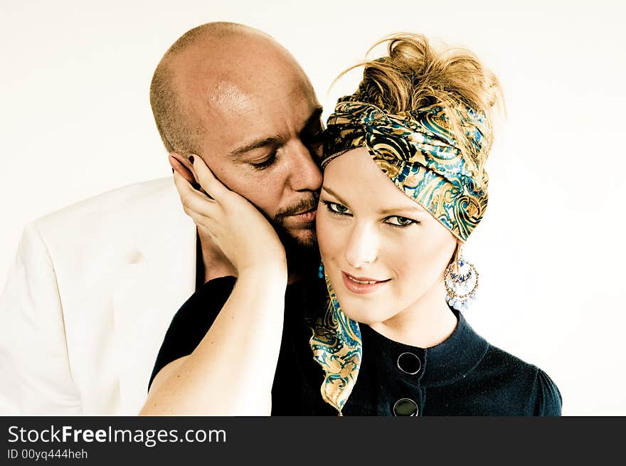 A young couple, photographed in the studio.