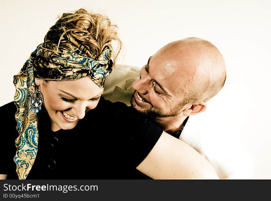 A young couple, photographed in the studio.