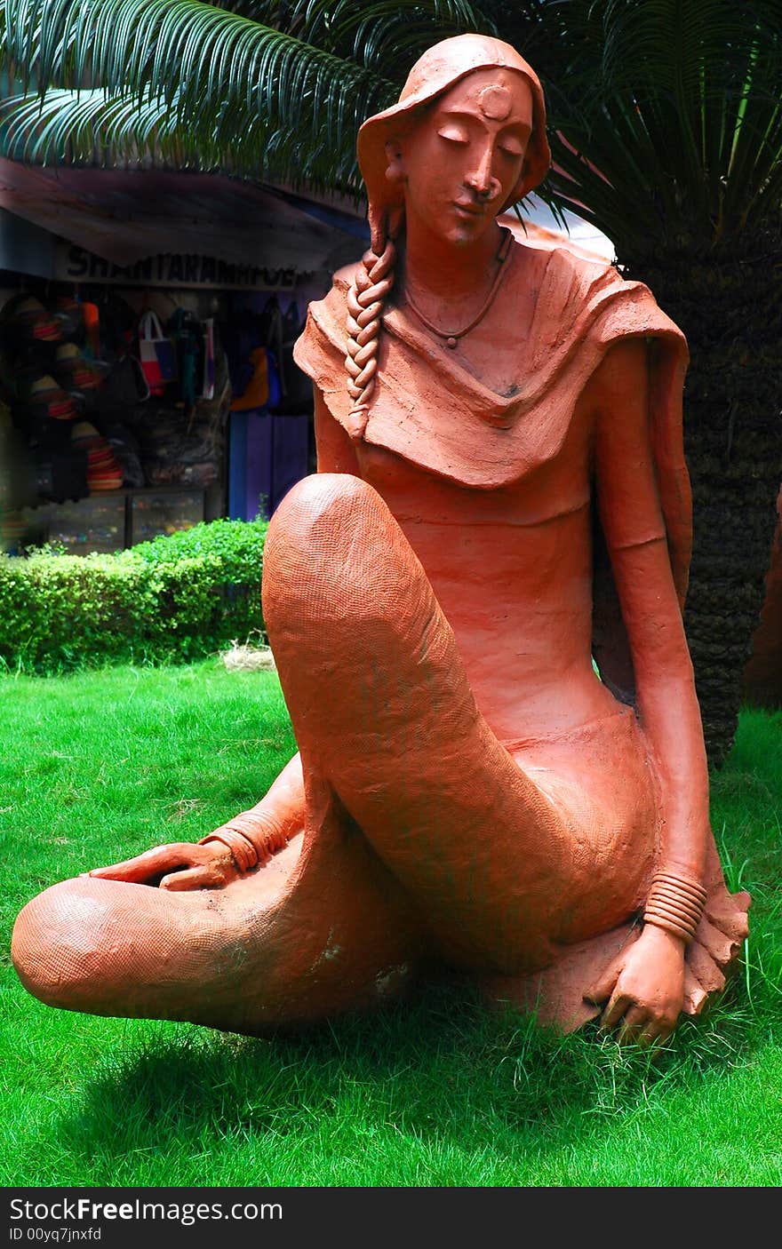 The sculpture of a young woman on road side of Goa town. The sculpture of a young woman on road side of Goa town.