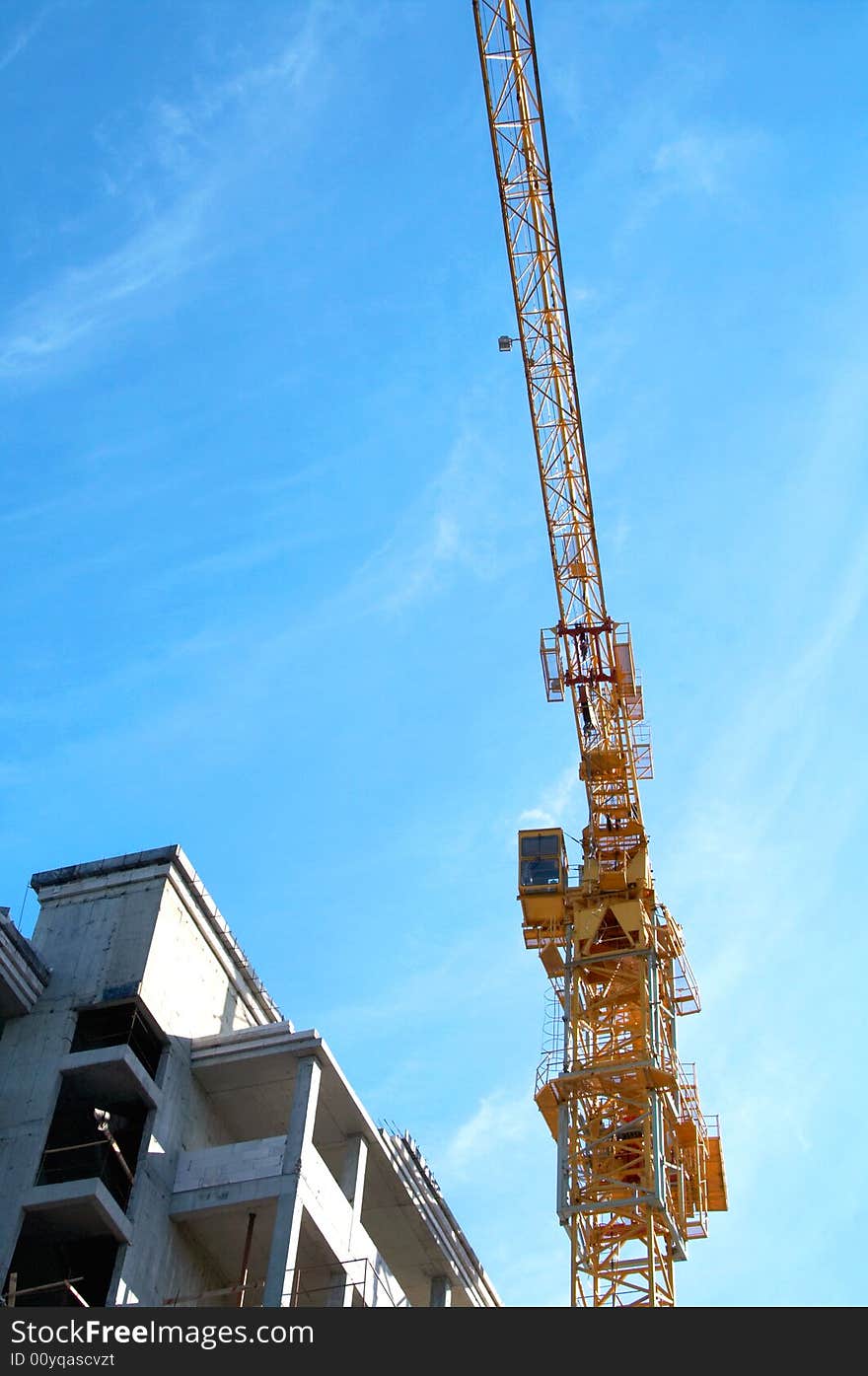 New building under construction with crane