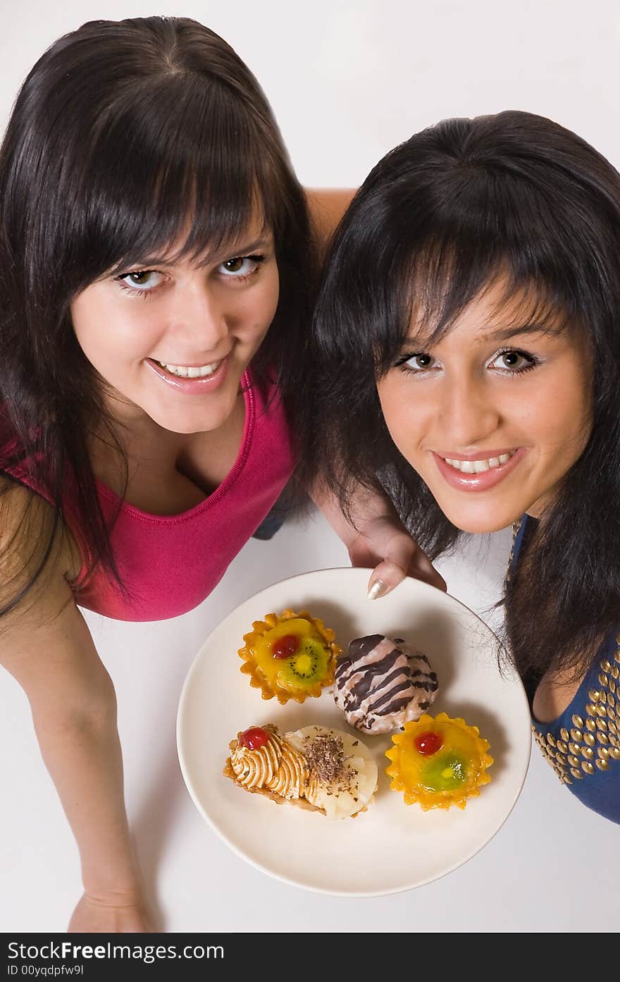 Two  girls with cakes