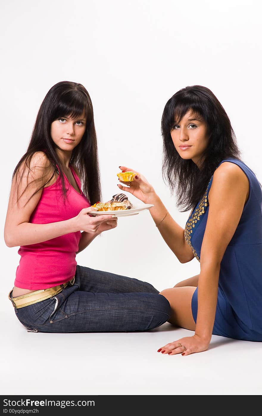 Two  girls with cakes