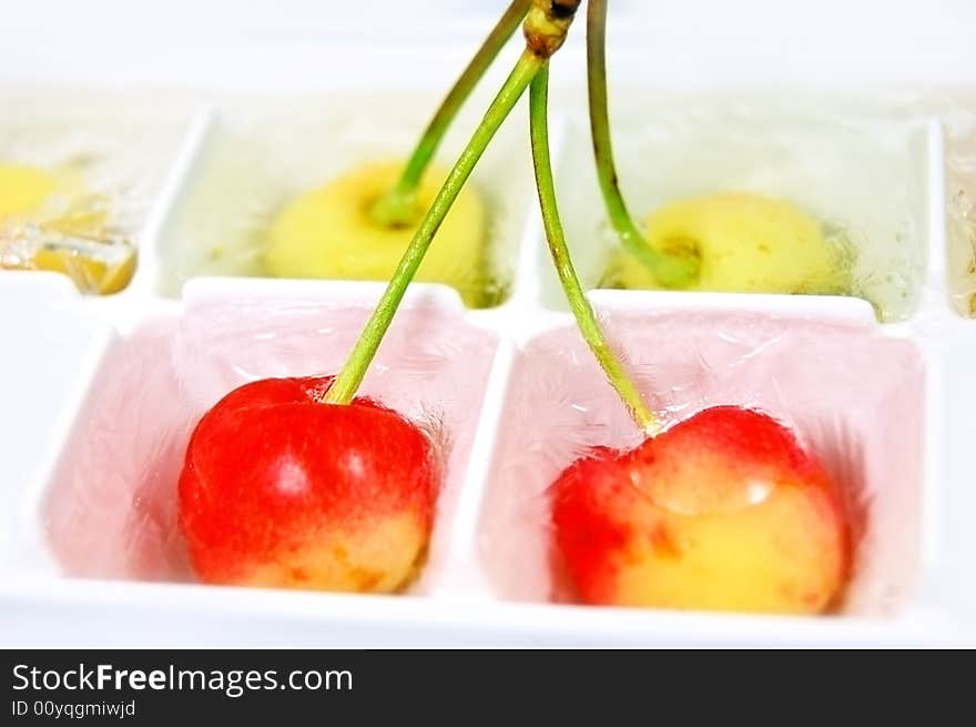 Light orange frozen cherries in some small boxes. Light orange frozen cherries in some small boxes