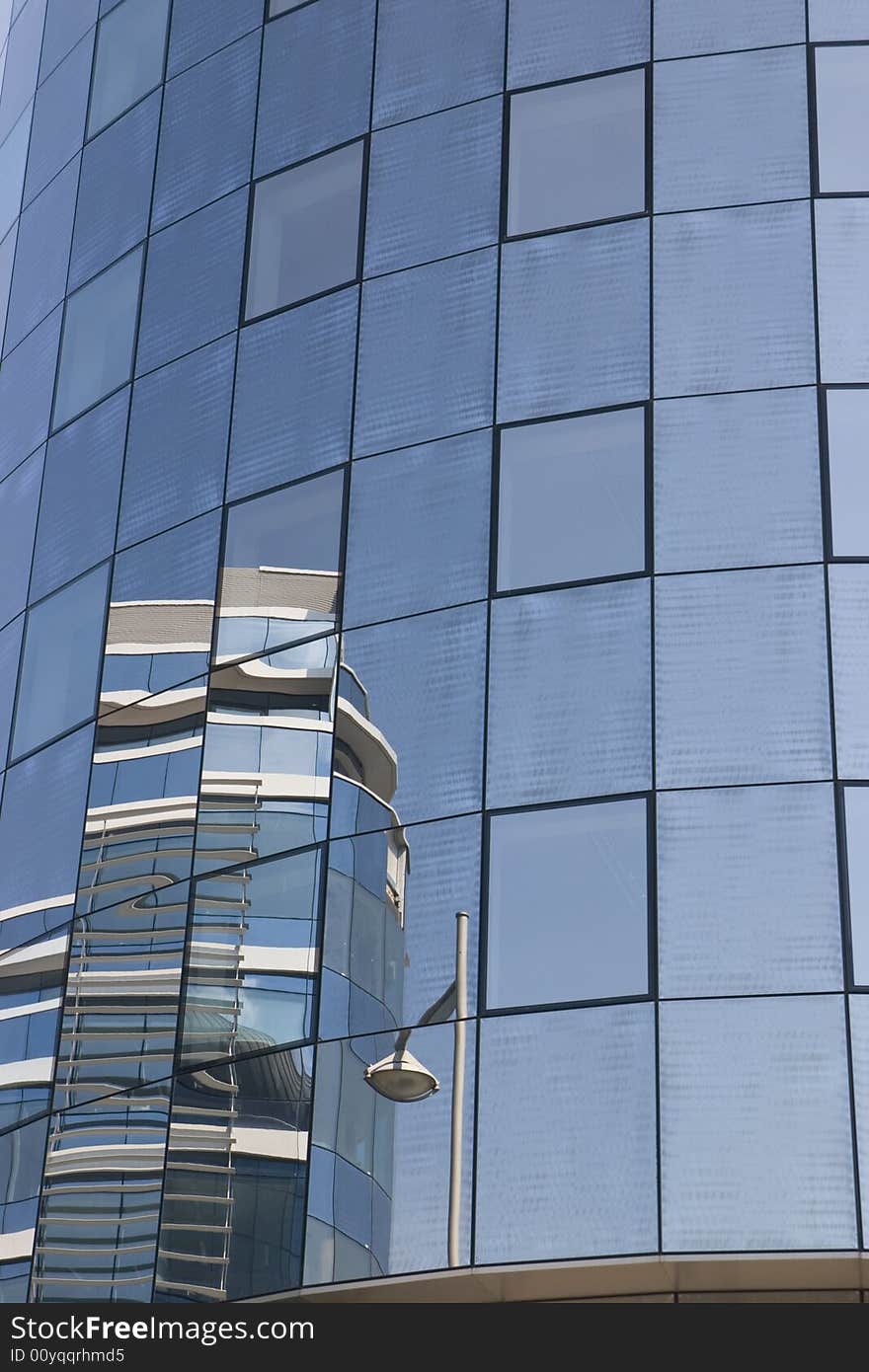 Modern glass blue house with reflection