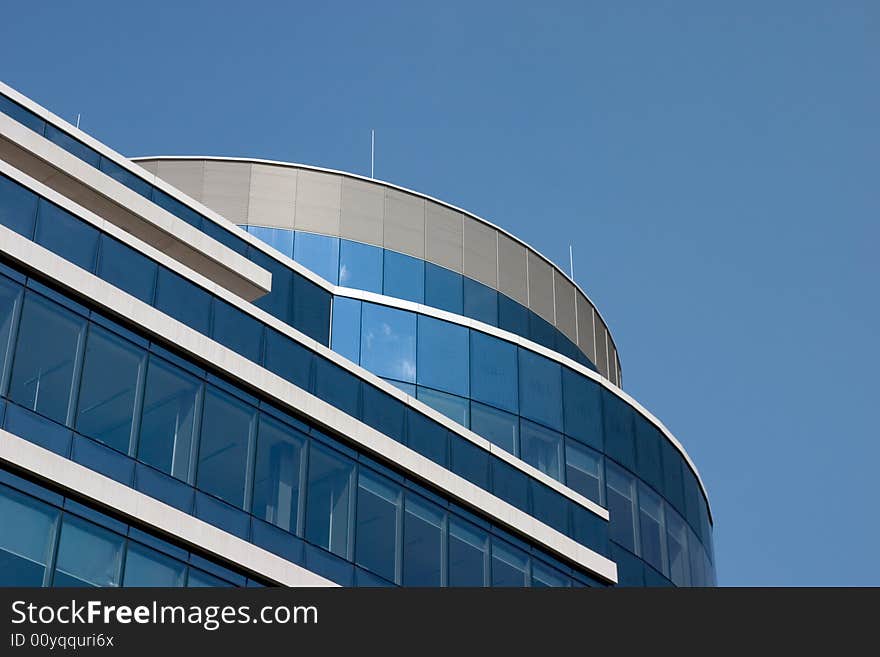 Modern blue glass house and sky