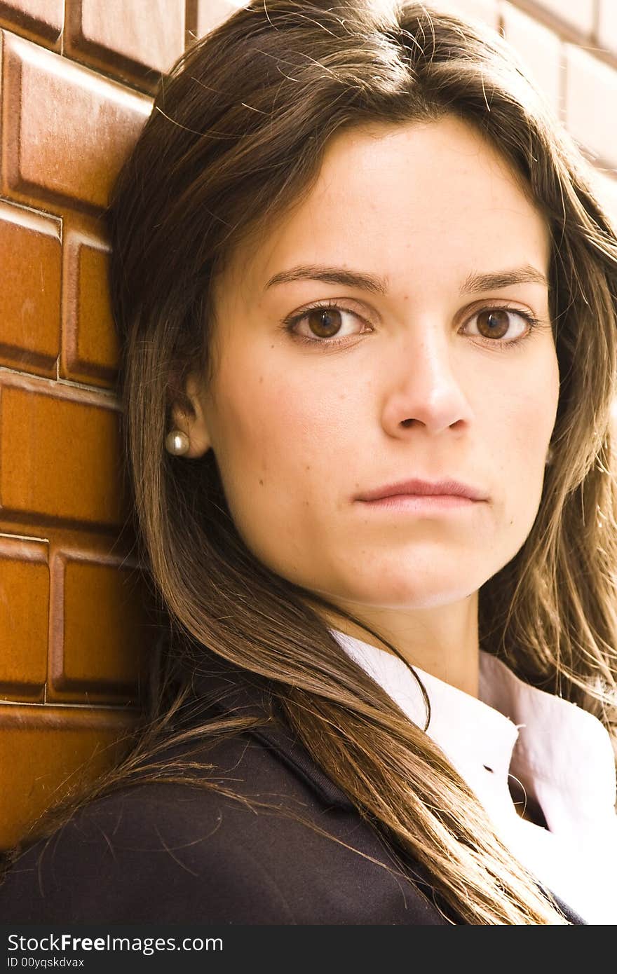 Long haired businesswoman staring at camera. Long haired businesswoman staring at camera.