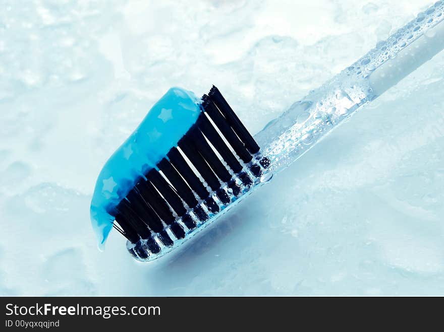 Closeup of tooth brush and tooth paste with water drops. Closeup of tooth brush and tooth paste with water drops